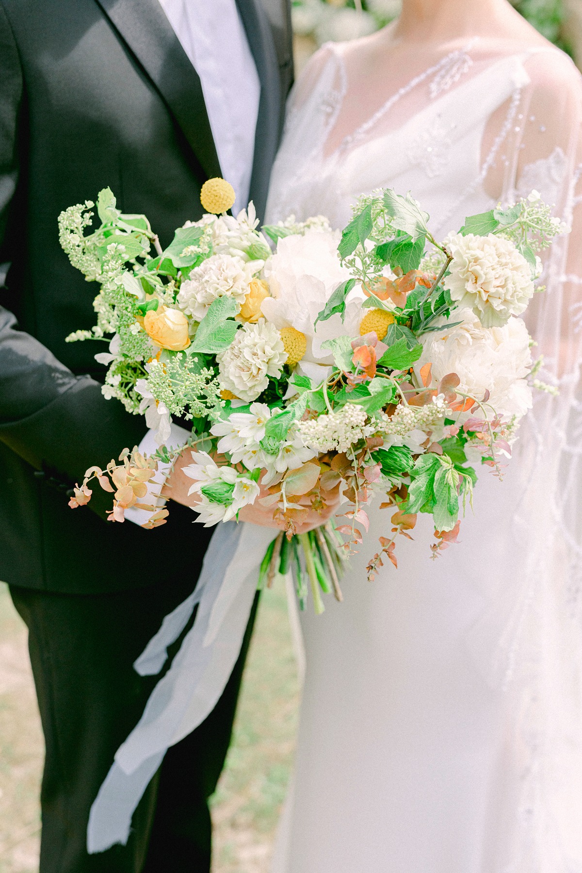 blue cream and orange bridal bouquet