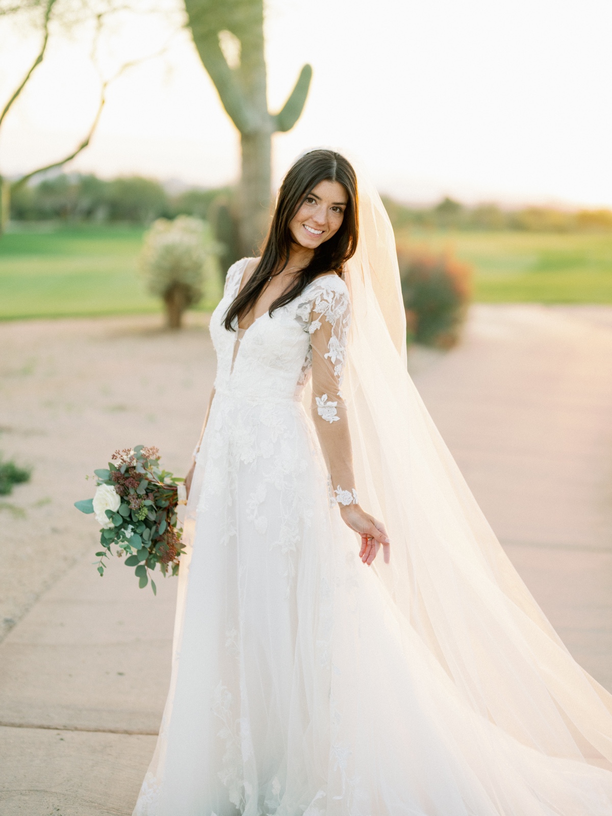 sheer long-sleeve wedding dress