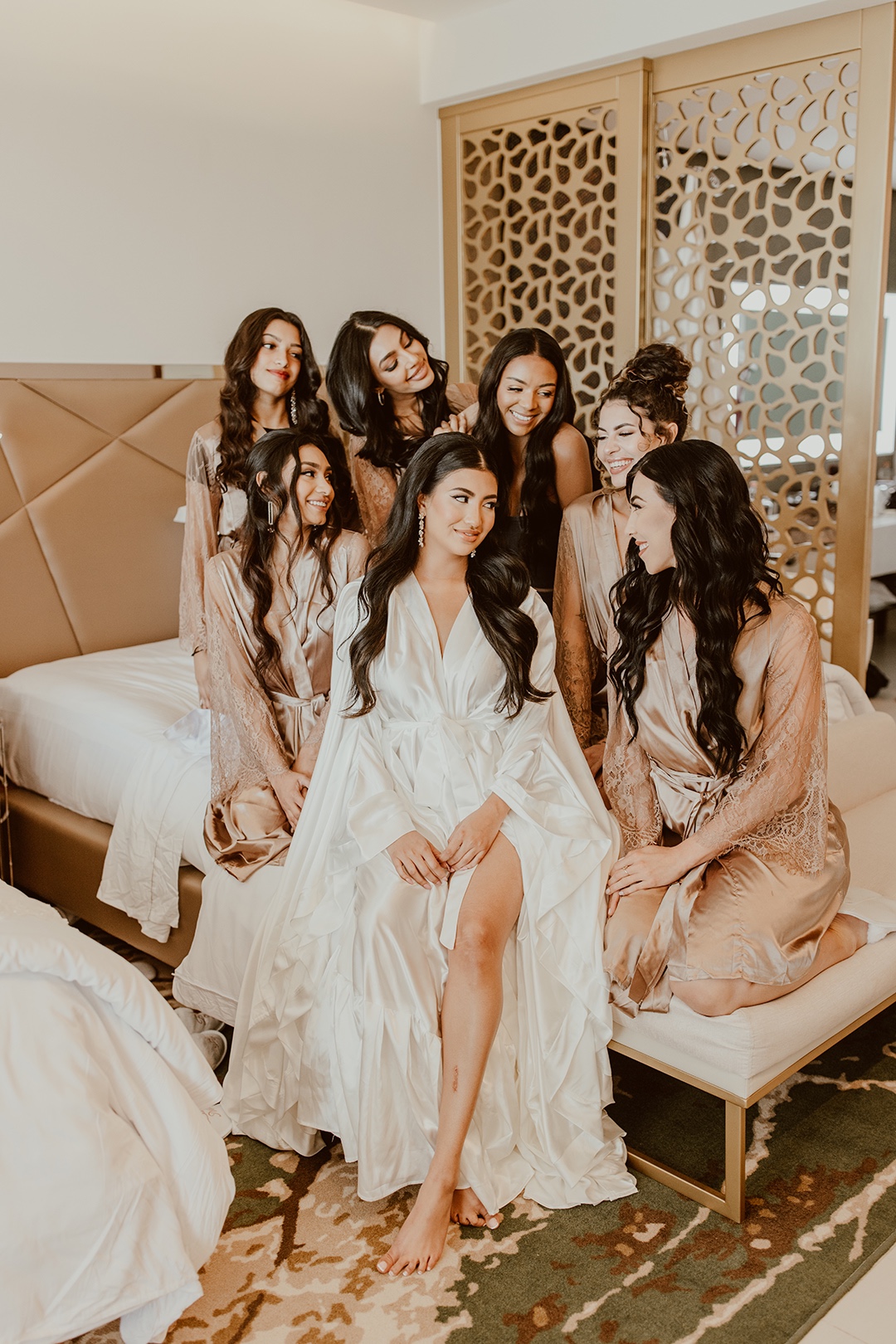 Bridesmaids in nude lace robes 