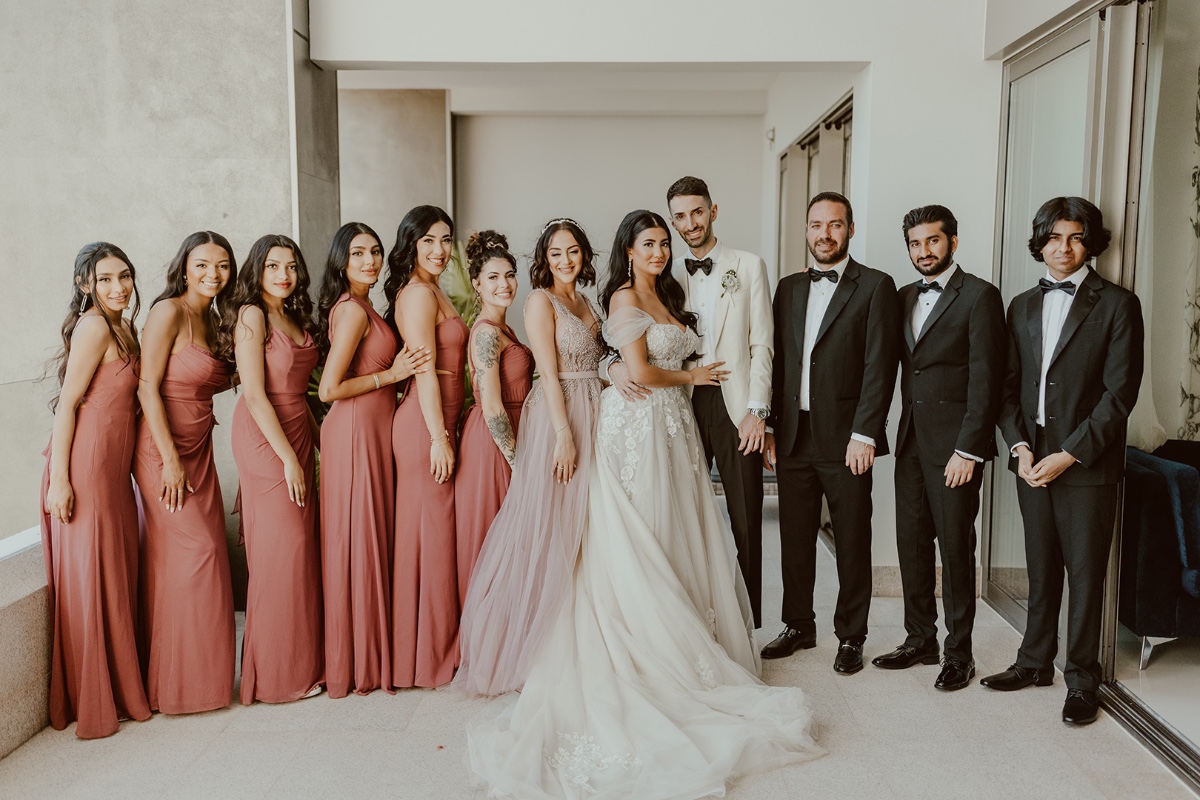 Chic bridal party in desert rose and classic tuxes