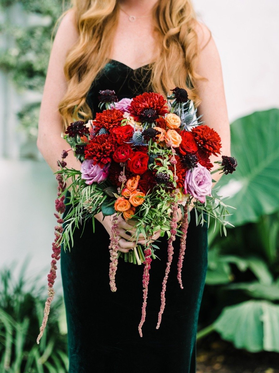 A stunning jewel toned wedding with an emerald bridal gown