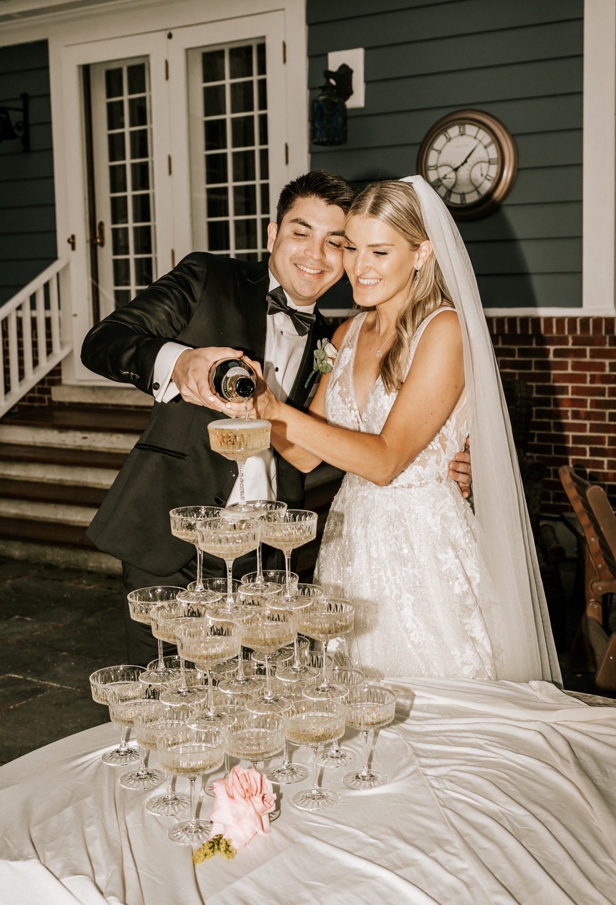 Bride and groom with champagne tower