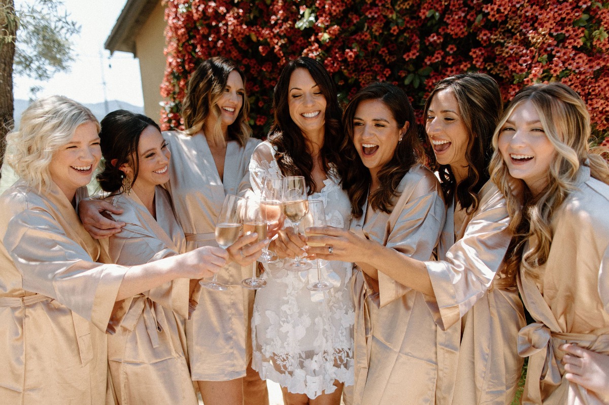 rose champagne toast with bridesmaids