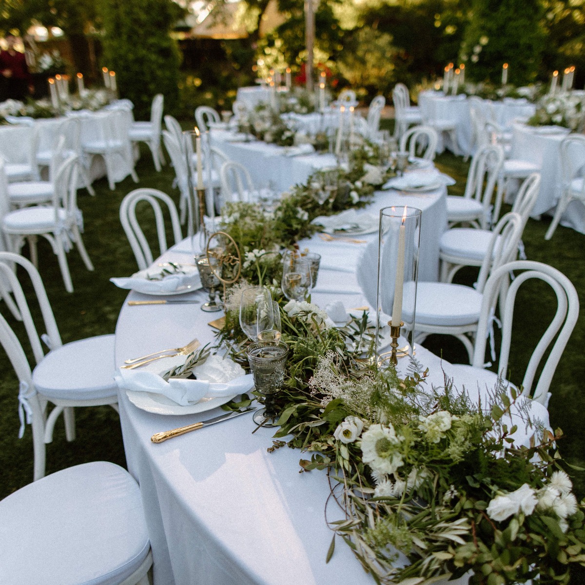 serpent tables and garland centerpieces 