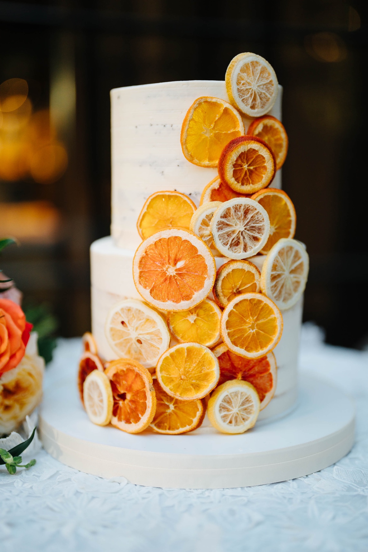 dried citrus on buttercream wedding cake