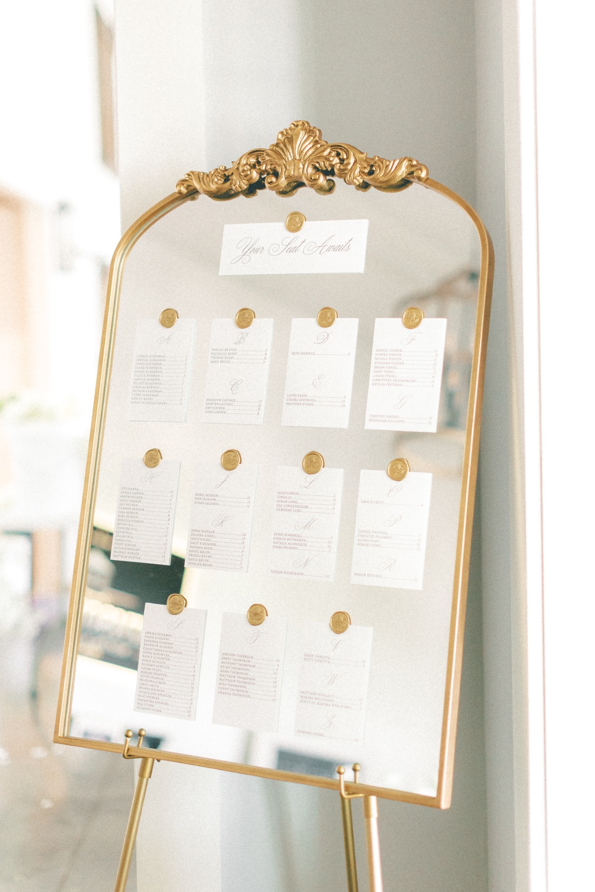 gold vintage seating chart mirror