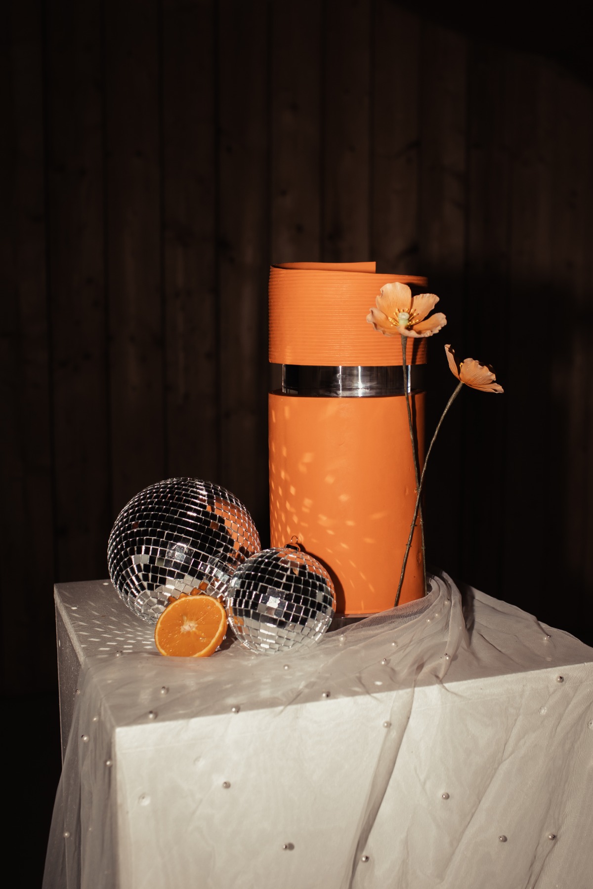 Modern orange floral wedding cake 