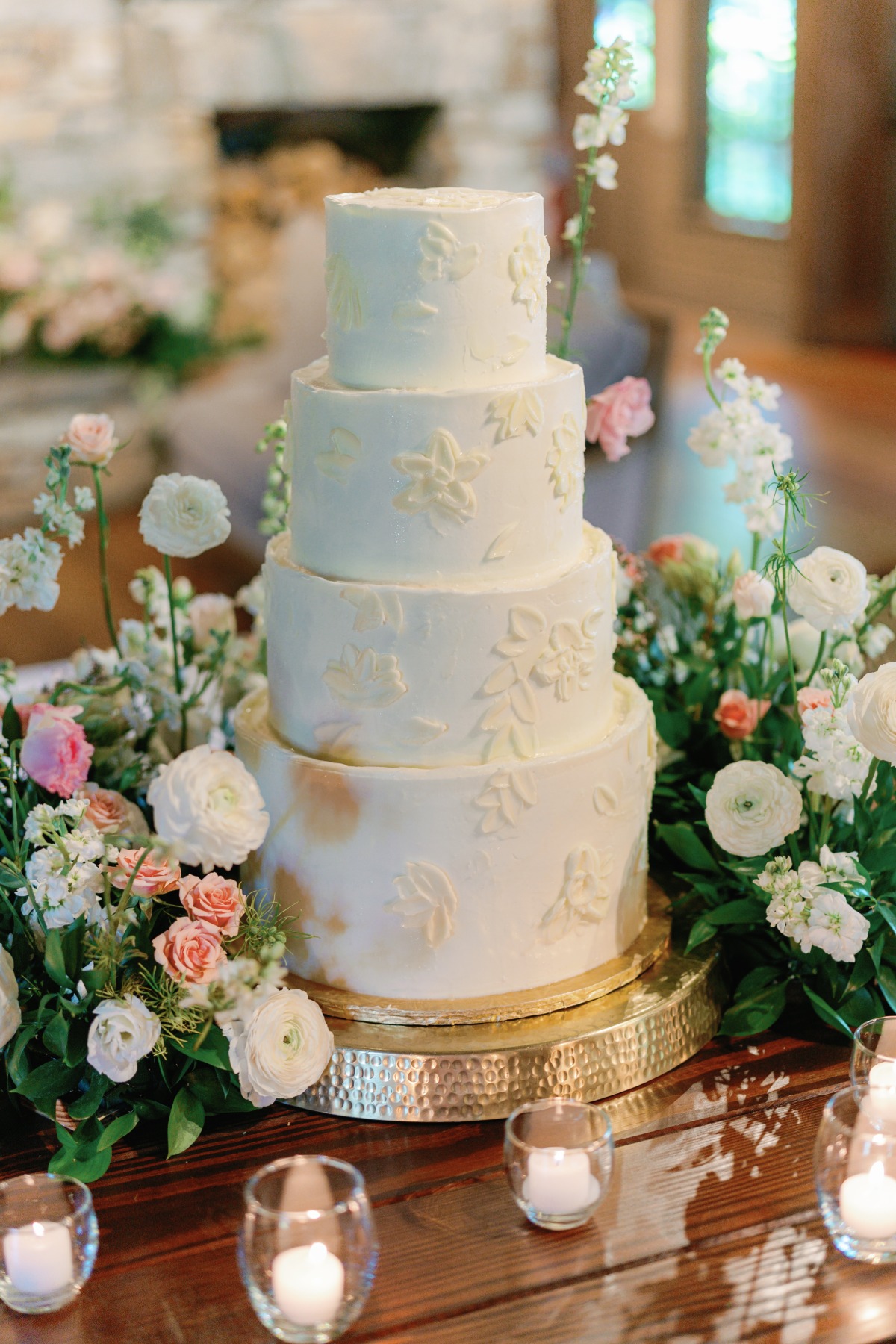 four tiered buttercream wedding cake