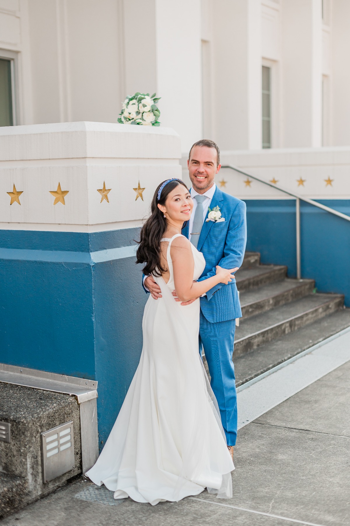 Nautical wedding couple with blue accents 