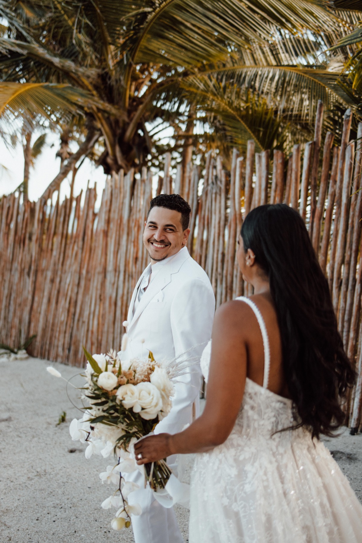 Upscale boho beach wedding in mexico with a macrame installation