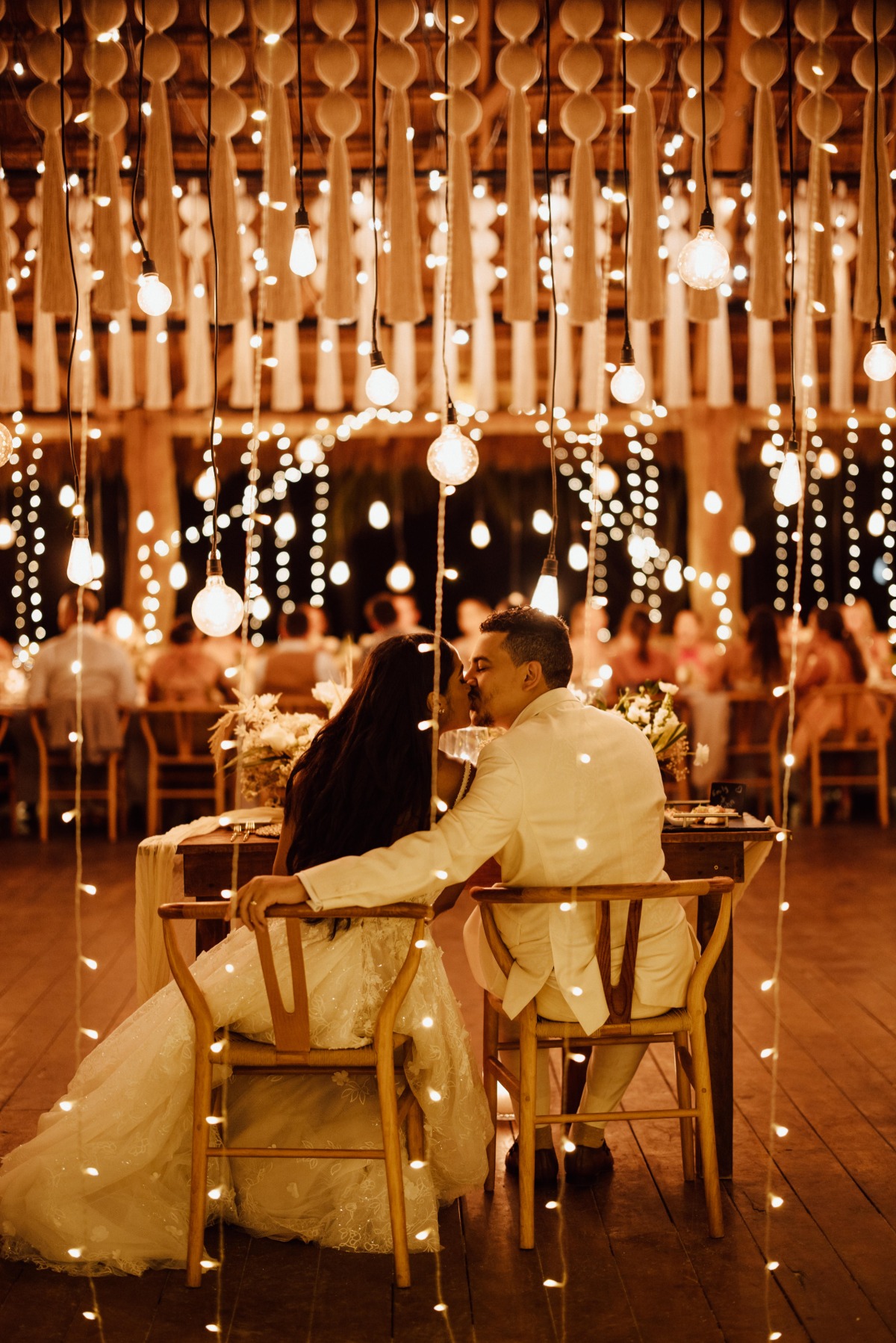 sweetheart table at beach wedding with twinkle lights
