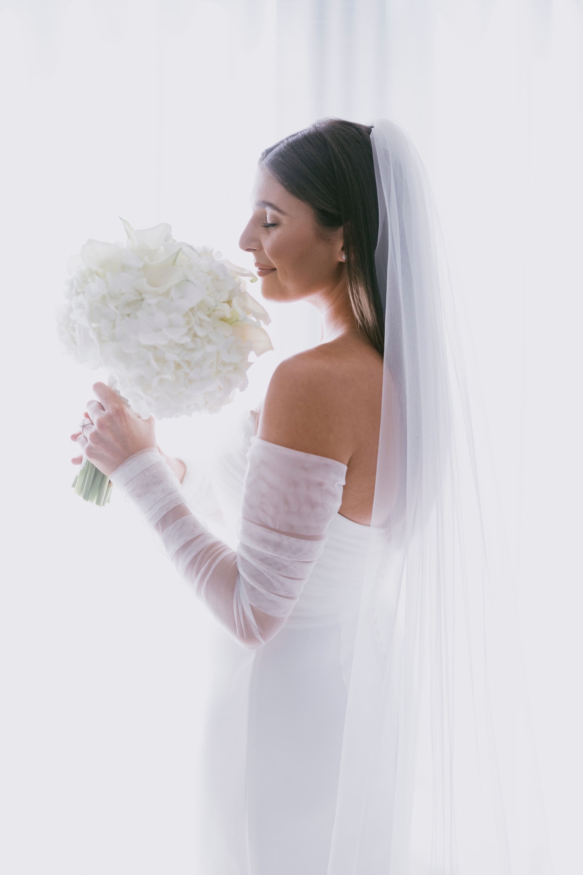 Bride sniffing bouquet 