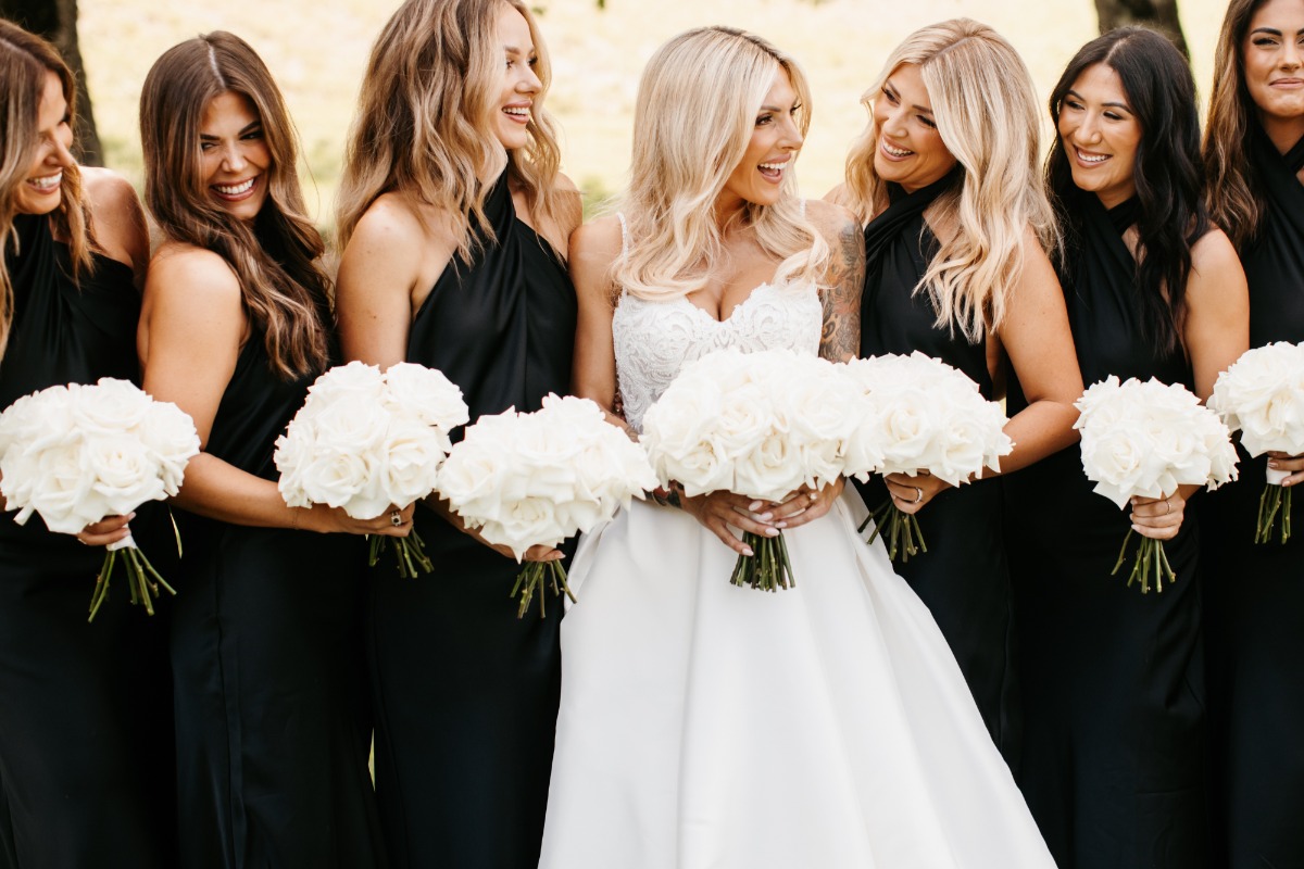 Jennifer Watson and bridesmaids in black dresses