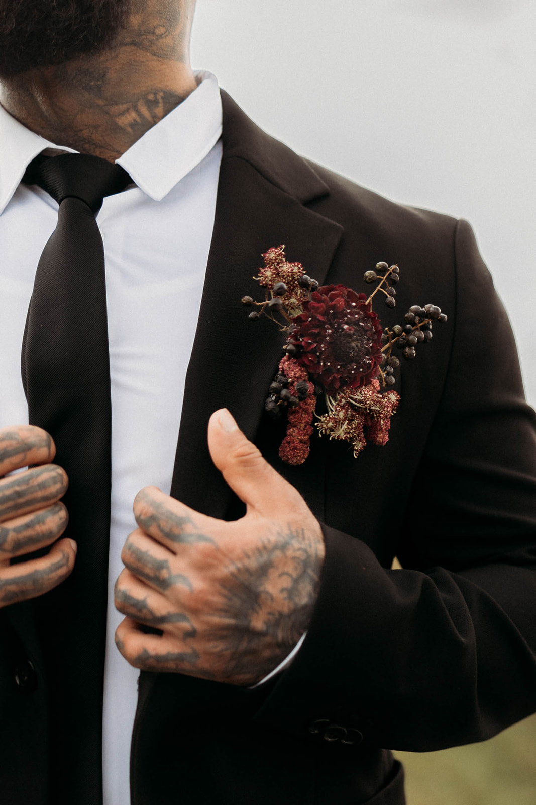 Dark and moody groom boutonniere 