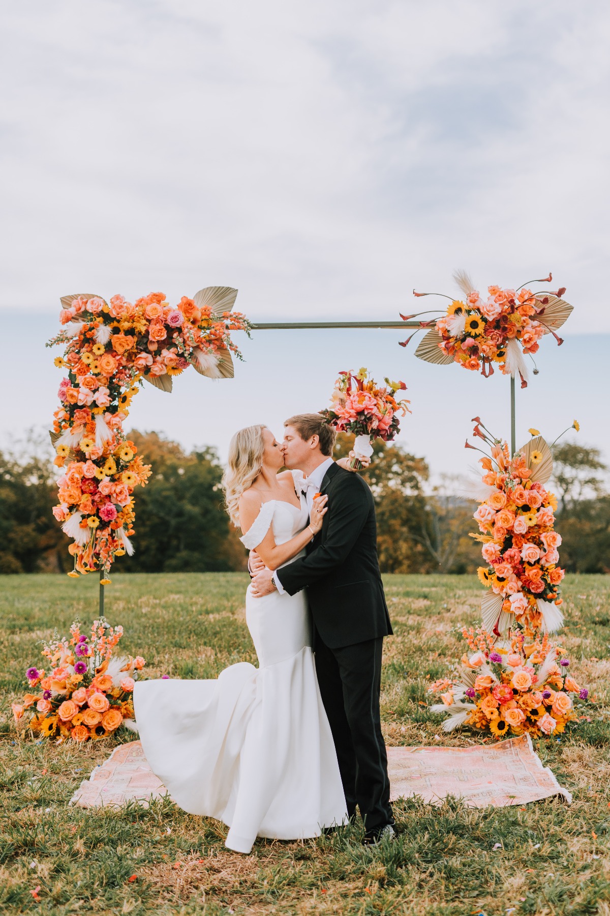 Bold and vibrant floral wedding arch 