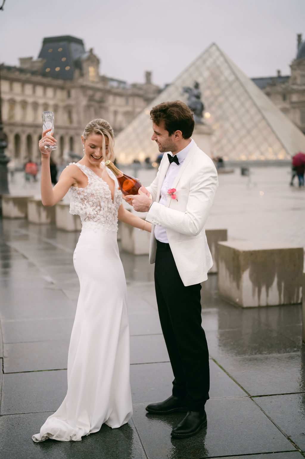 Bride and groom popping rose in Paris 
