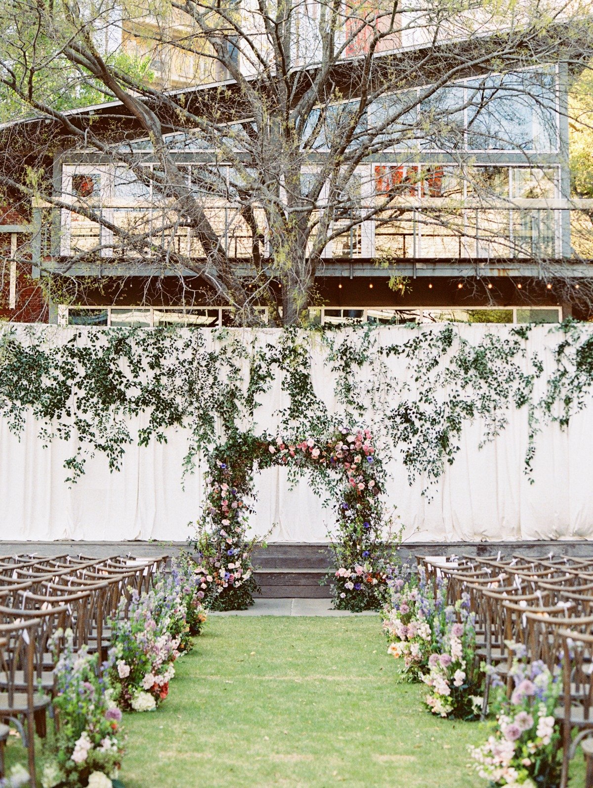 pink and periwinkle floral arch