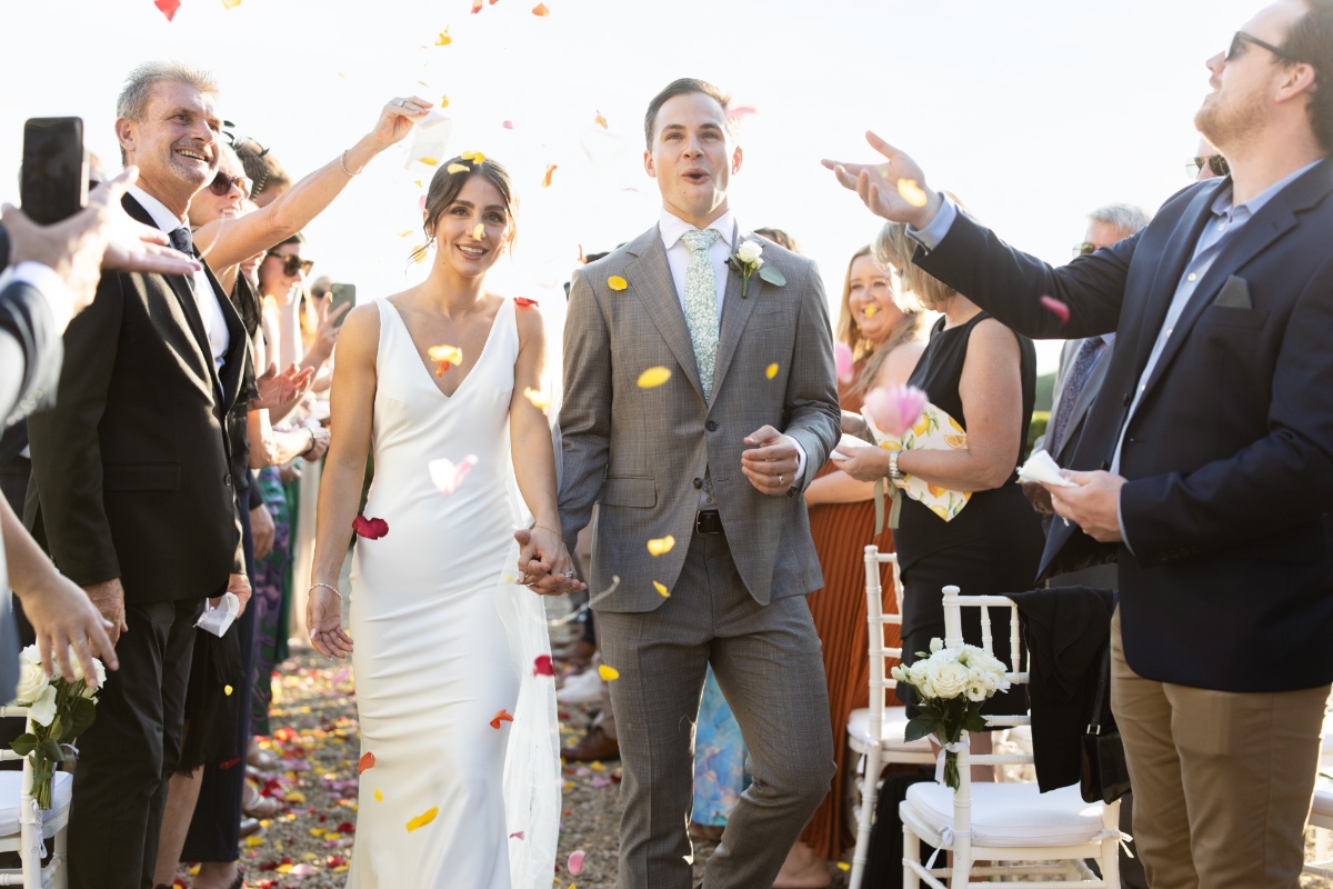 colorful rose petals for wedding ceremony exit