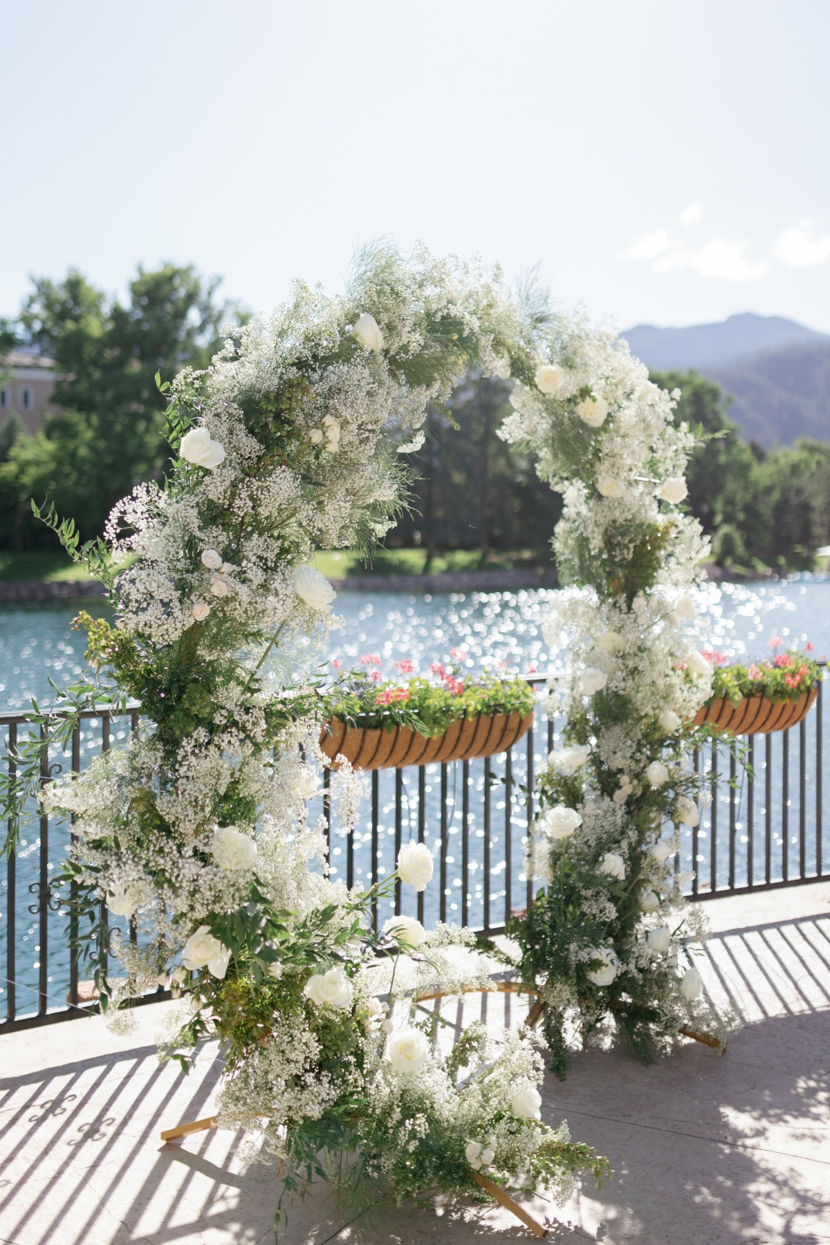 baby's breath and white rose floral arch