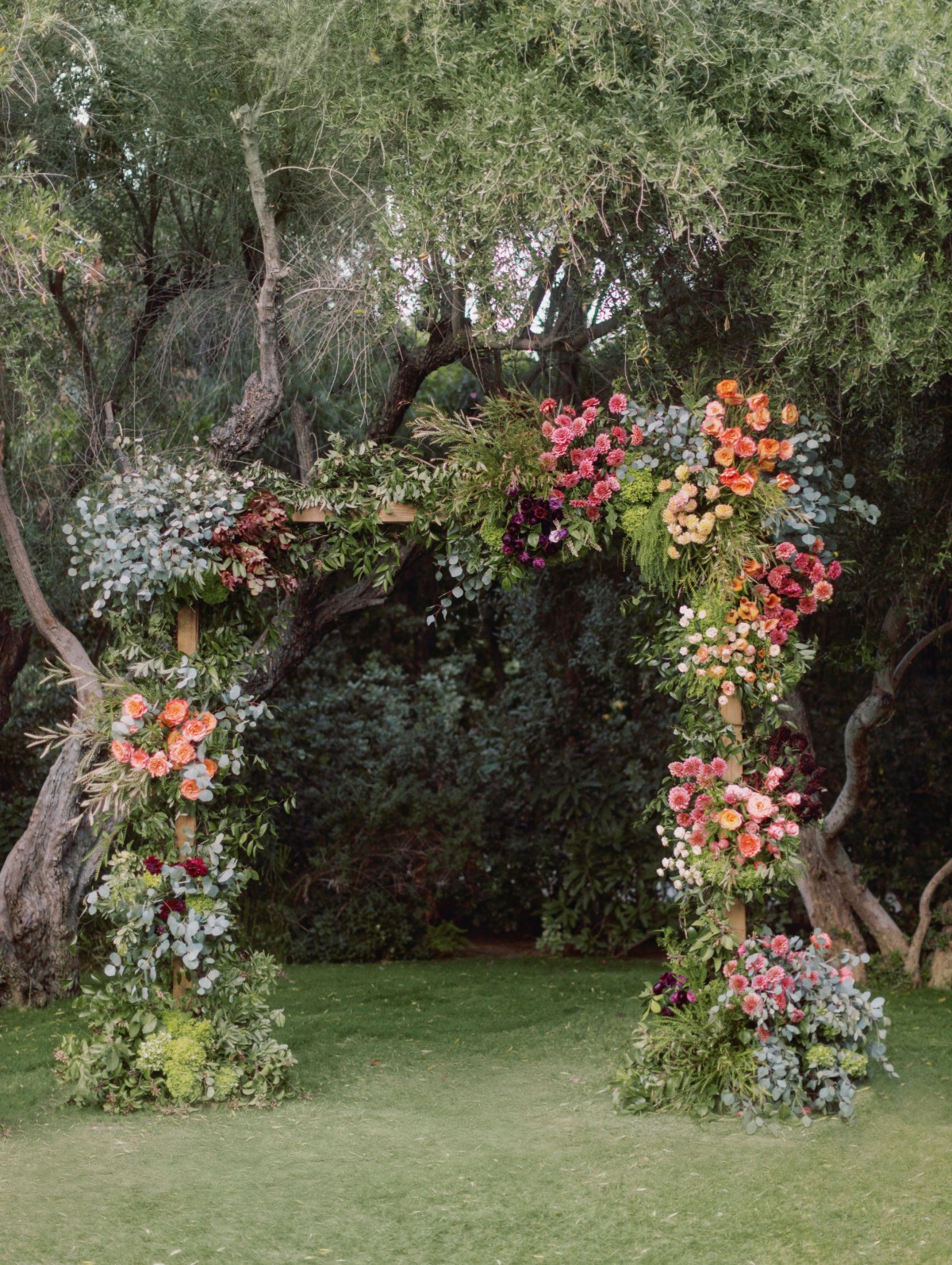 muted colorful floral arch