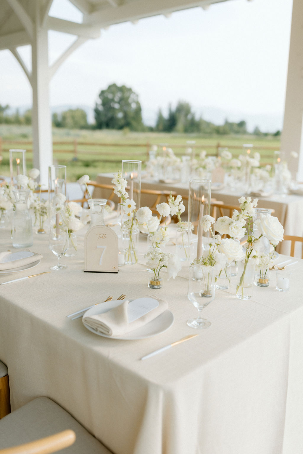white linen and glass wedding centerpieces