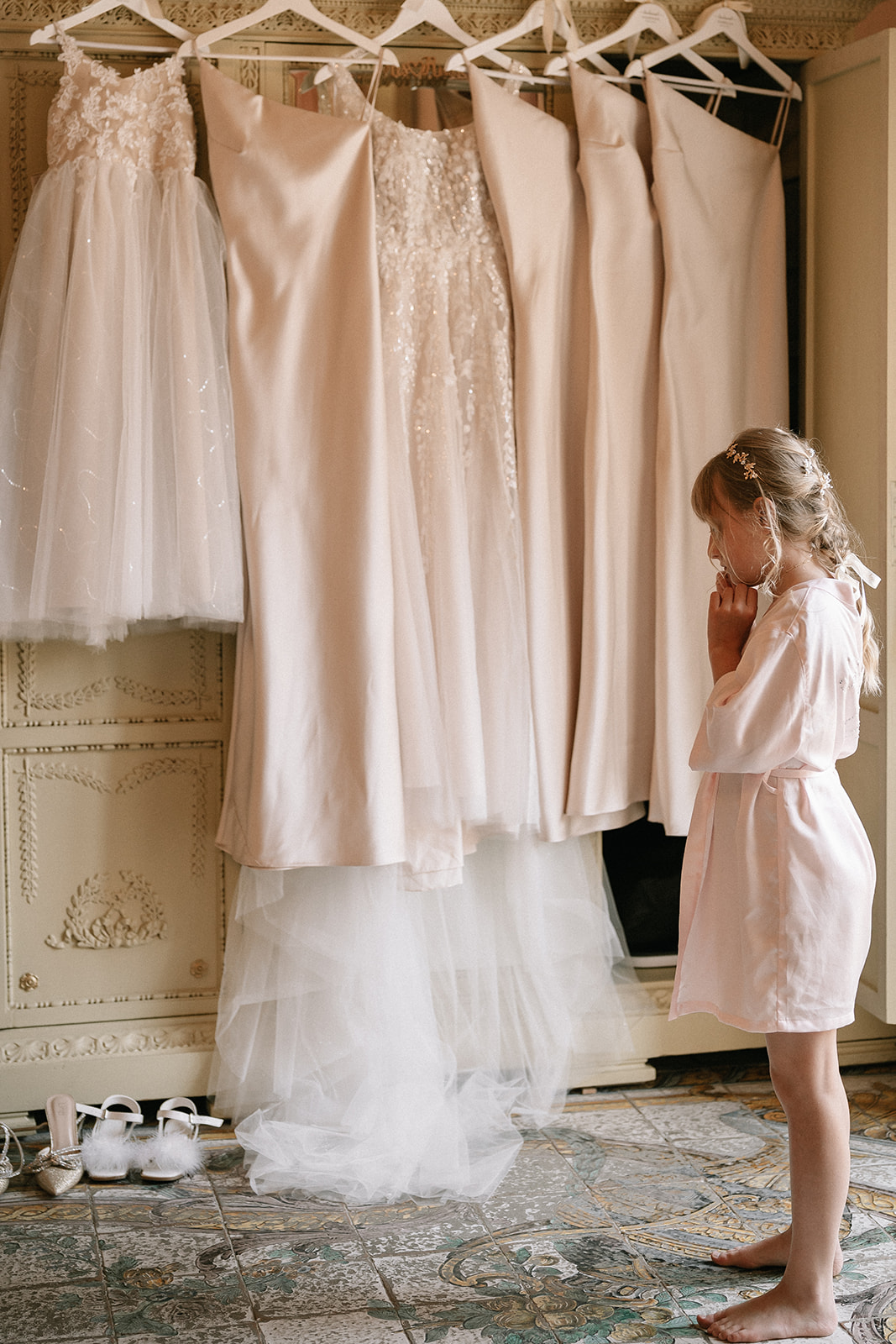 flower girl looking at bridal party dresses