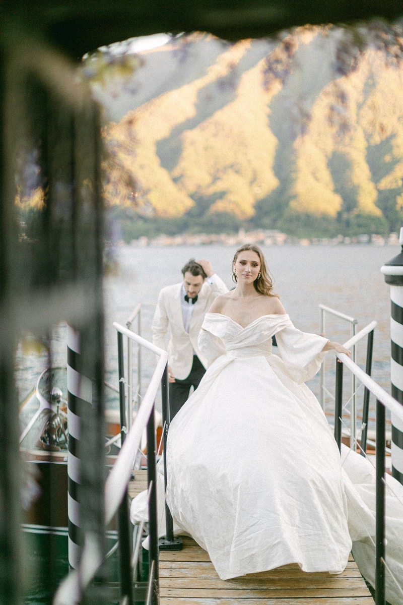 Lake Como bride and groom on dock 