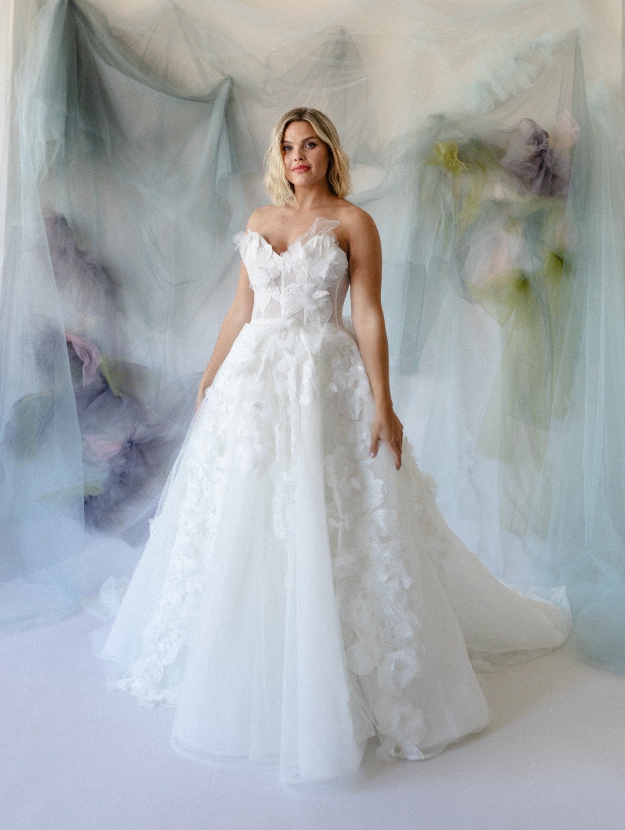 wedding dress with 3-D flowers by Carol Hannah