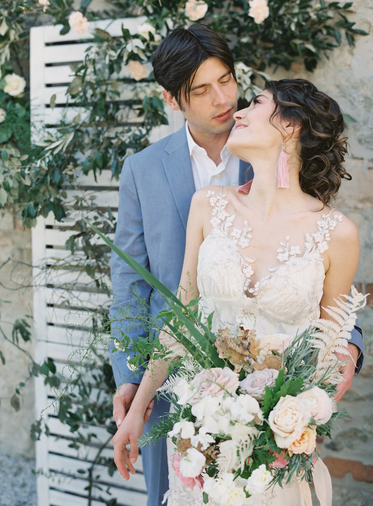 Dreamy, romantic wedding ceremony with wood paneled backdrop