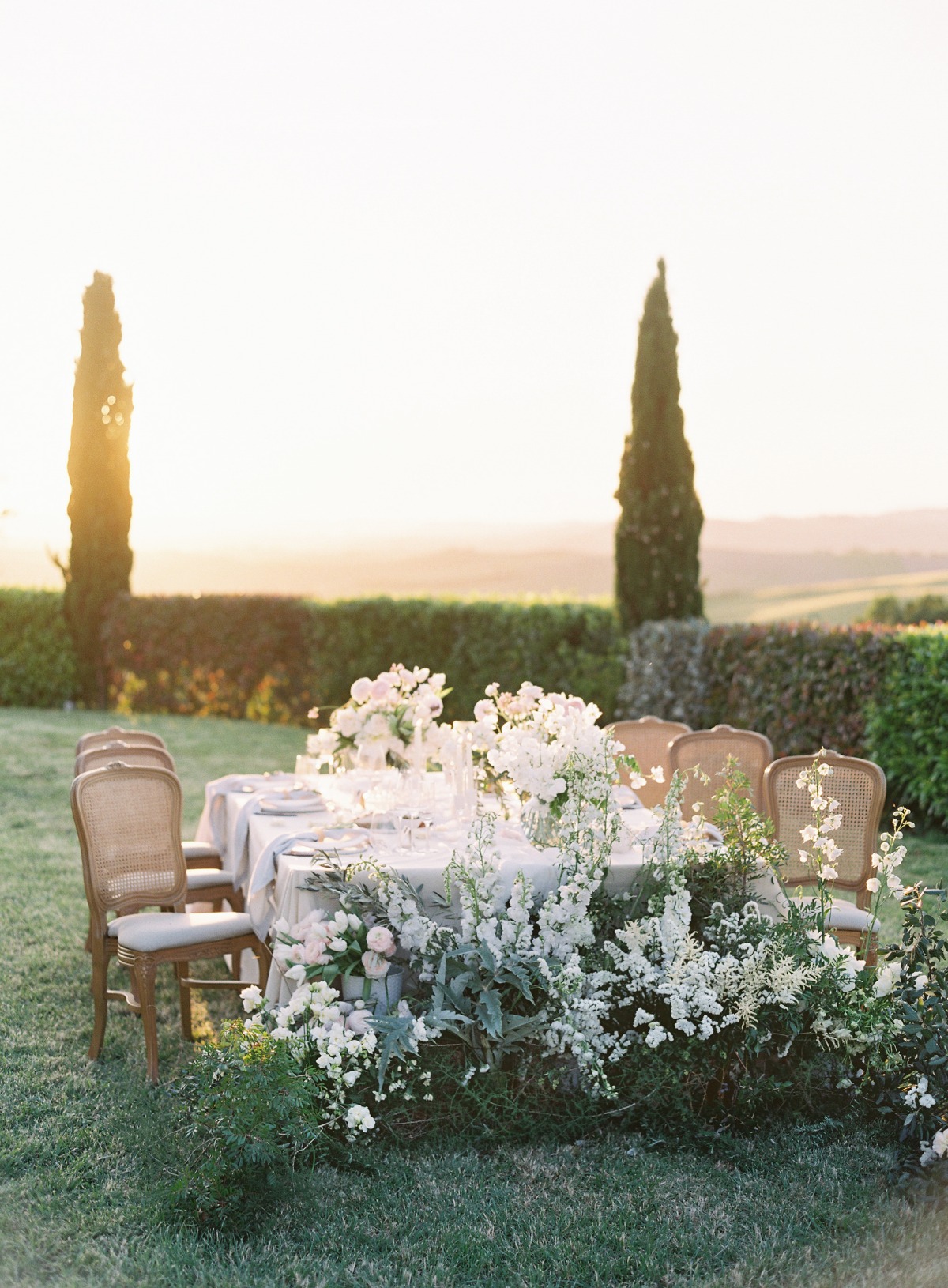 Elegant, chic white floral wedding reception at Italian villa