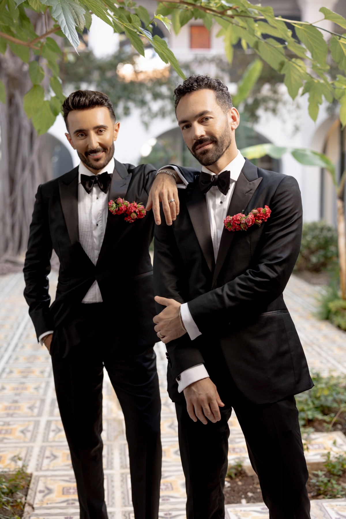 Fashionable grooms in sleek tuxedos and gold accessories 