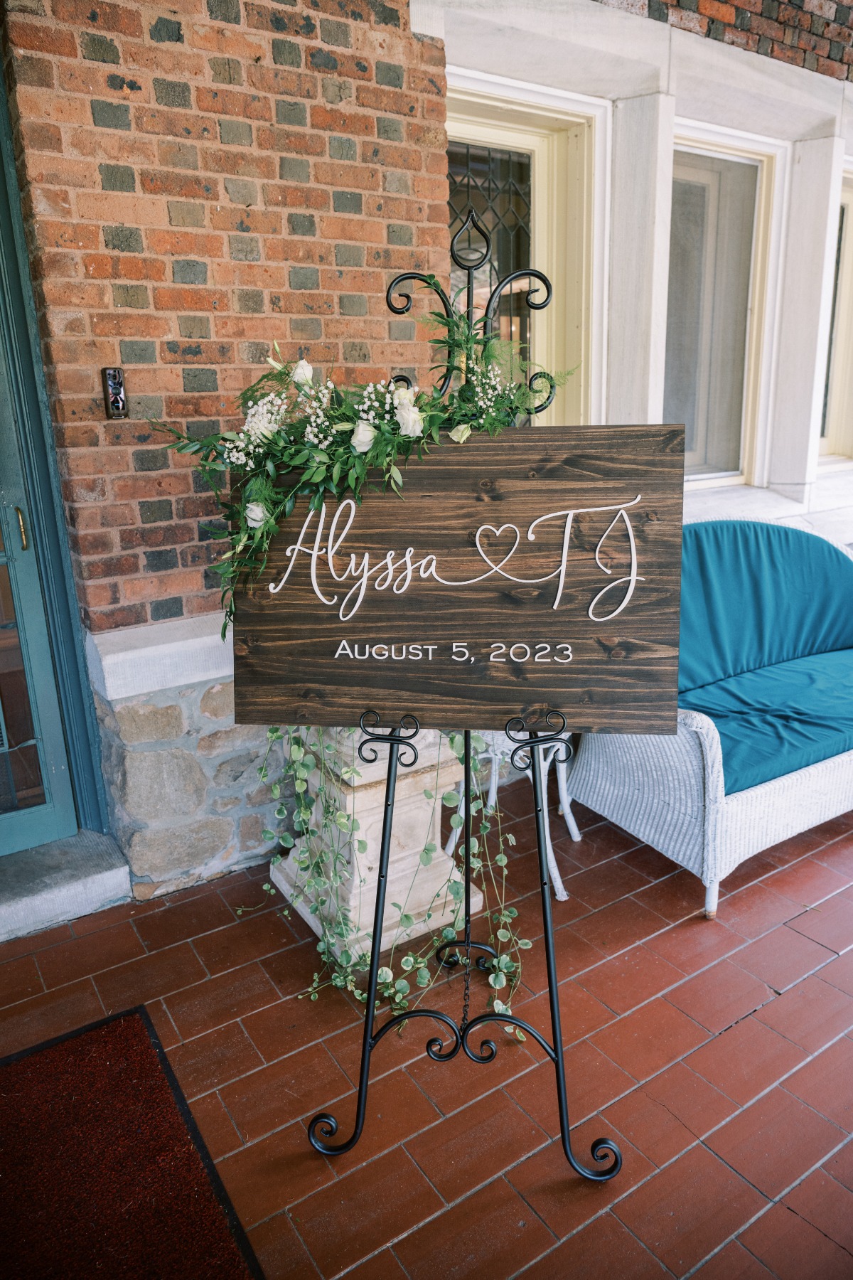 Modern boho wooden welcome sign with green florals 