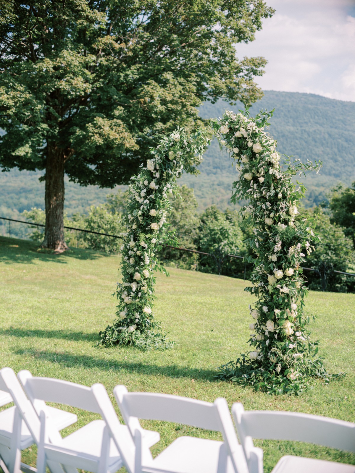 Beautiful disconnected white and green floral arch 