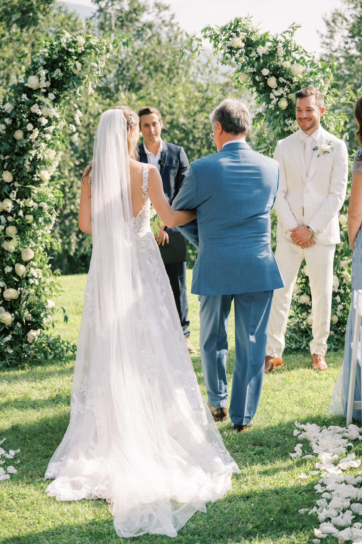Elegant Vermont bride walking down wedding aisle with dad 