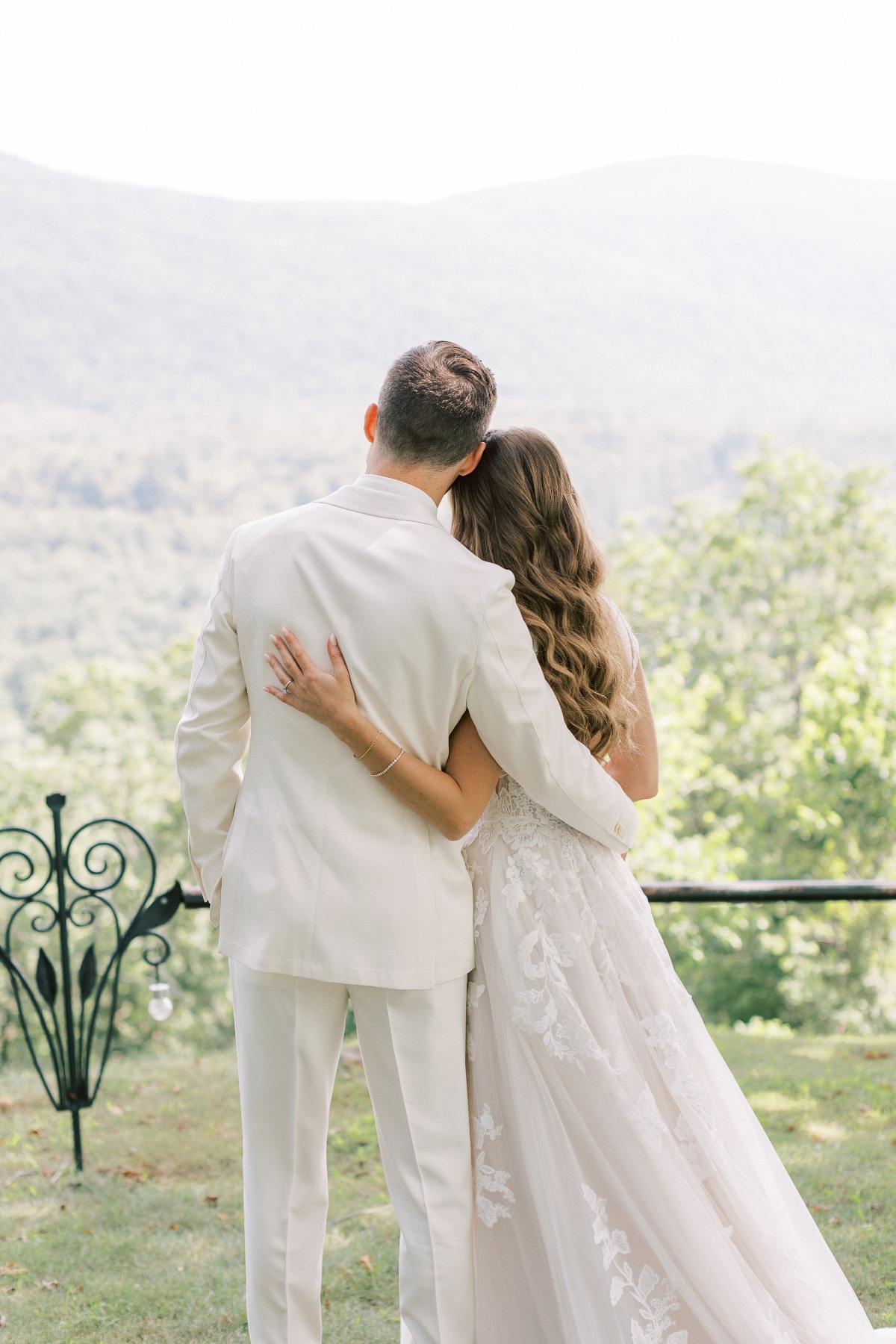 Bride and groom admiring the rolling hills of Vermont