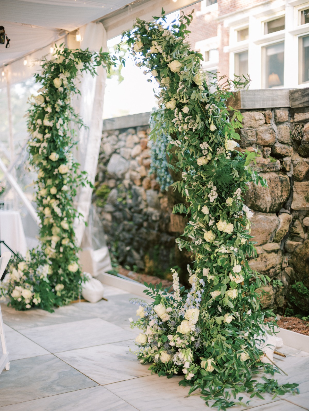 Deconstructed green and white floral arch for ceremony 