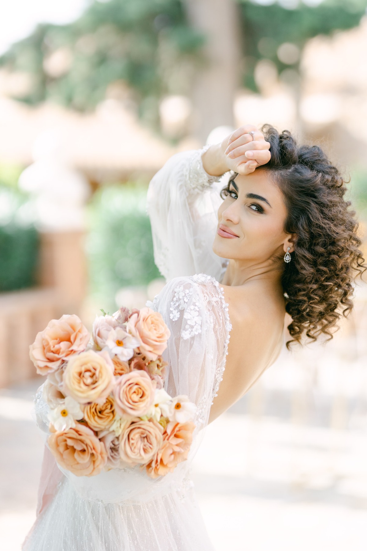 Playful and romantic Greek bride with bouquet 