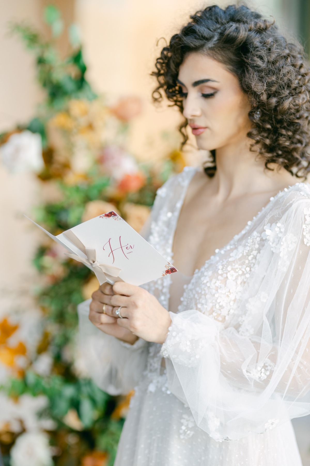 Elegant bride reading vows at timeless Greek wedding 