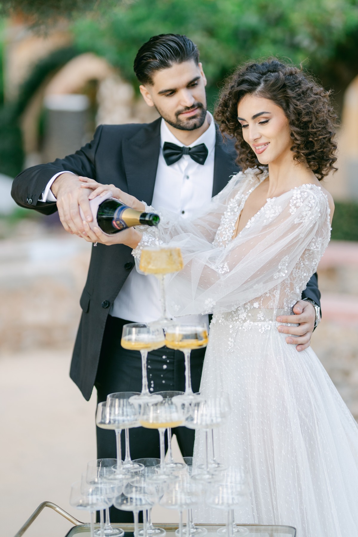 Timeless champagne tower toast for luxury destination weddings