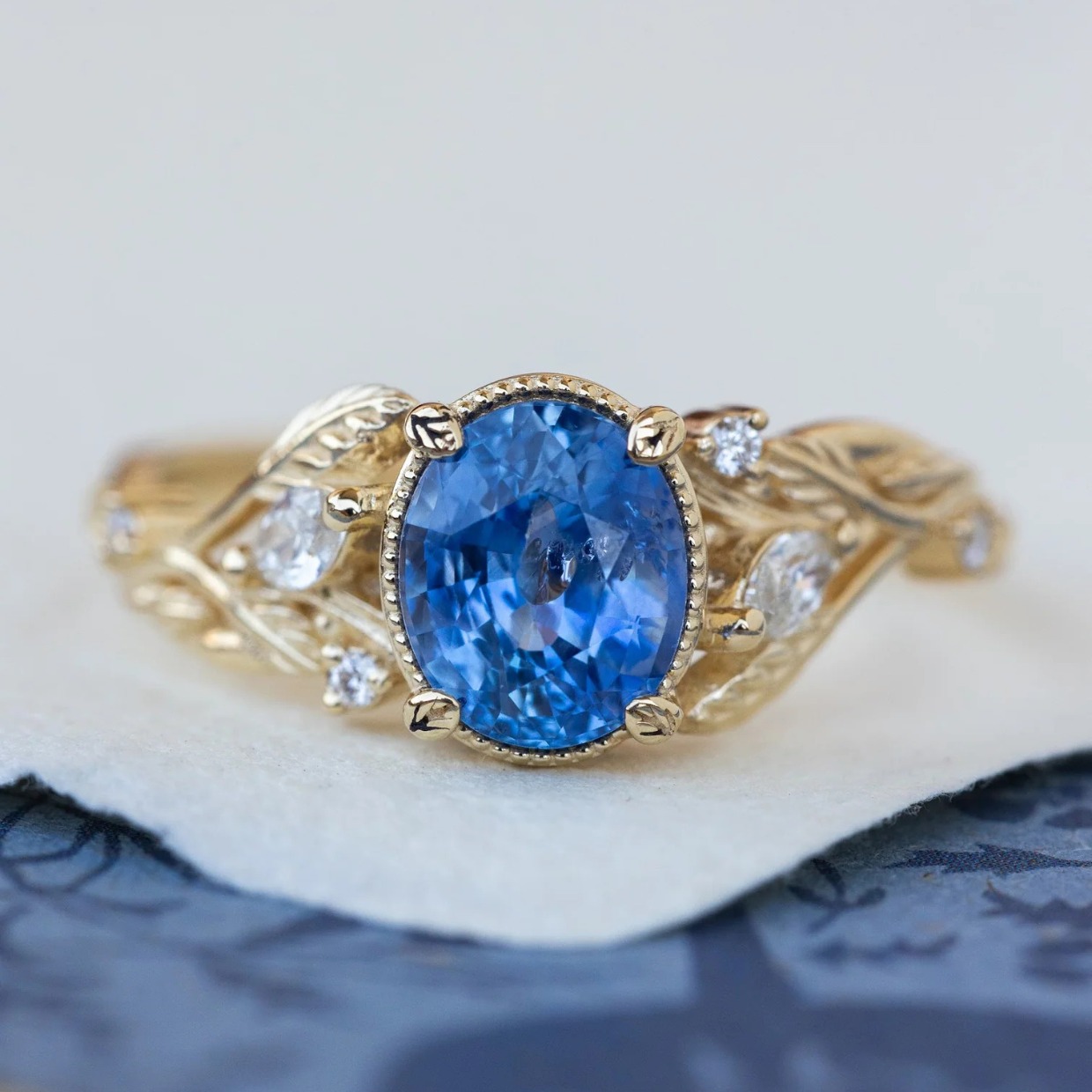 Blue sapphire and gold engagement ring 