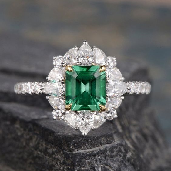 Emerald and moissanite engagement ring 