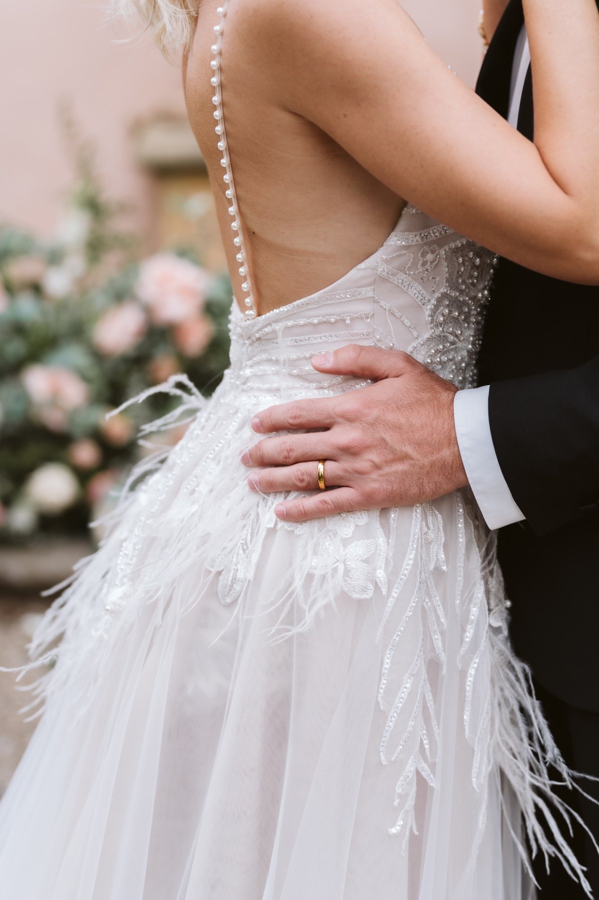 wedding gown with pearls and feathers