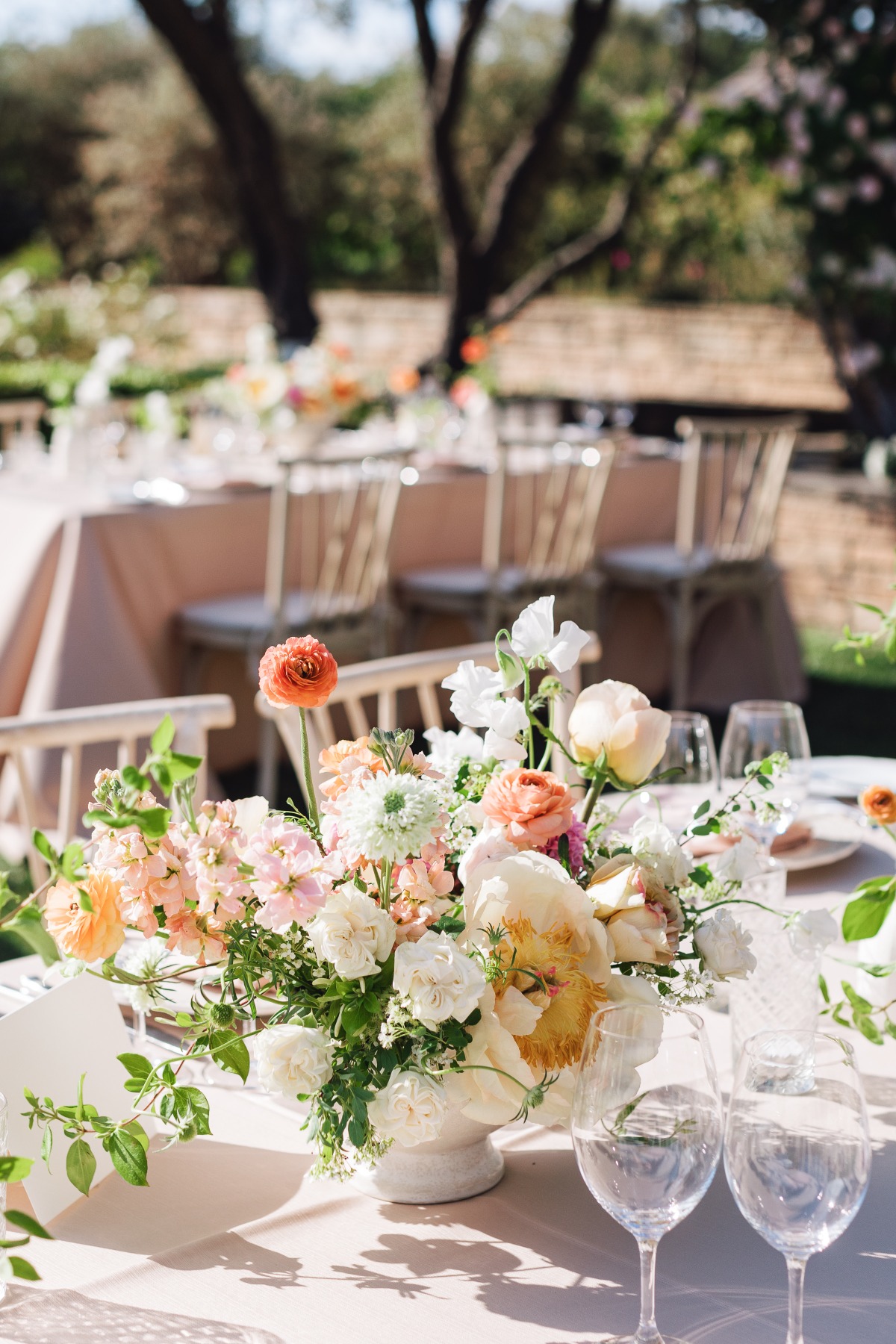 Peach and blush wedding centerpiece for garden reception