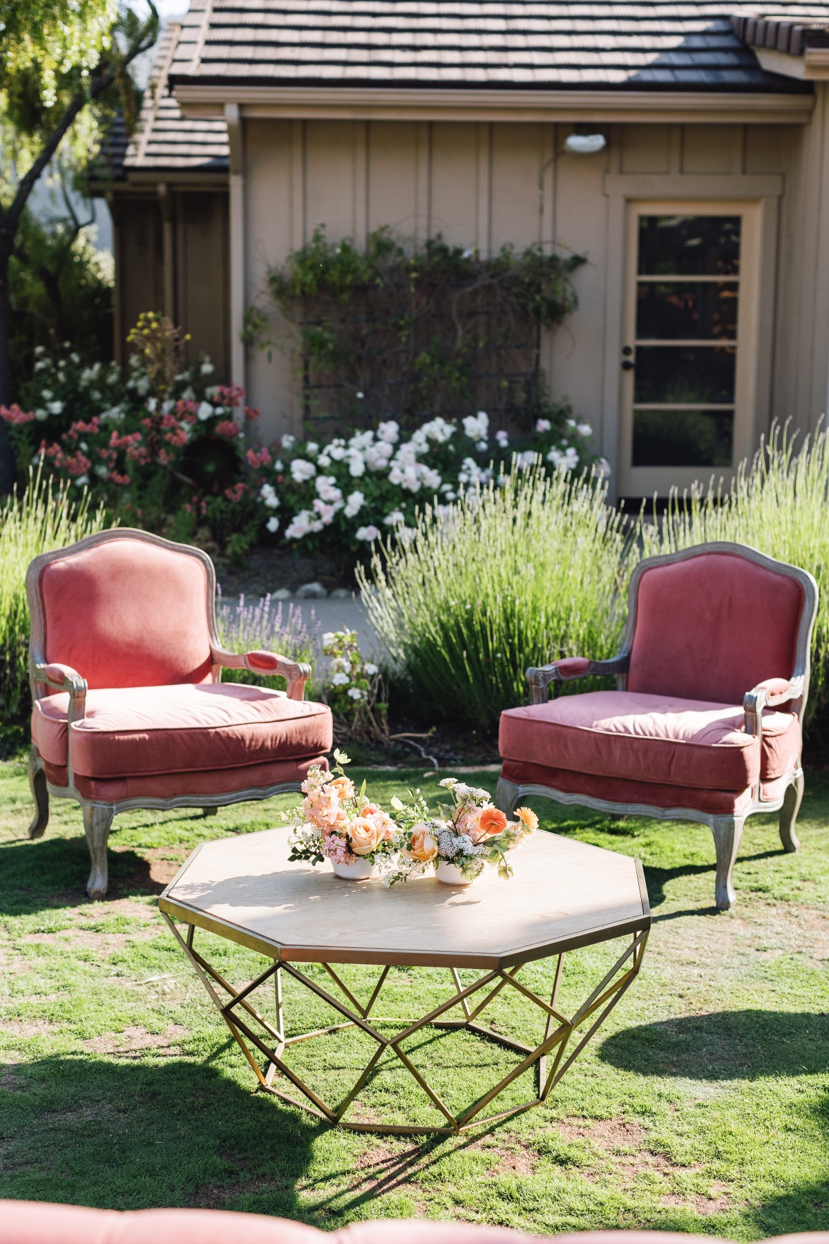 Vintage pink wedding lounge chairs for cocktail hour 