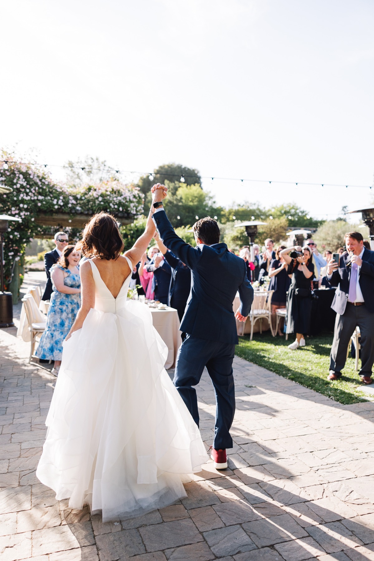 Bride and groom walking into reception in Carmel Valley