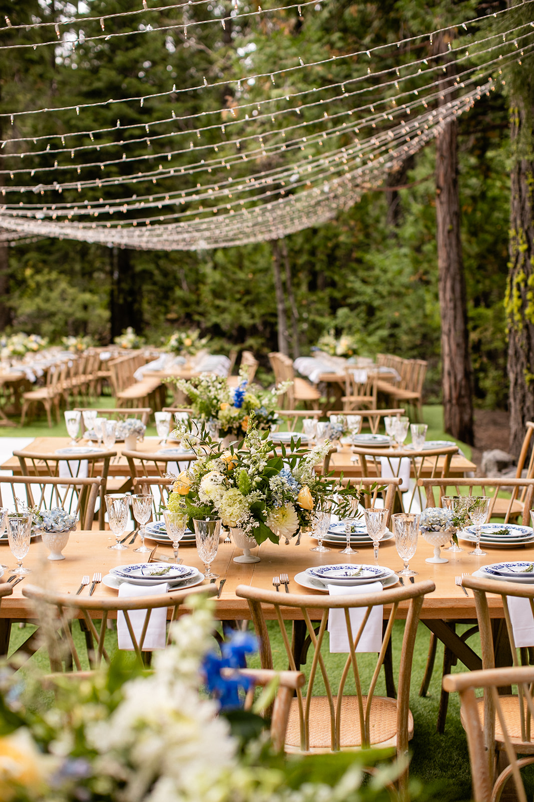 blue and white wedding reception with twinkle lights