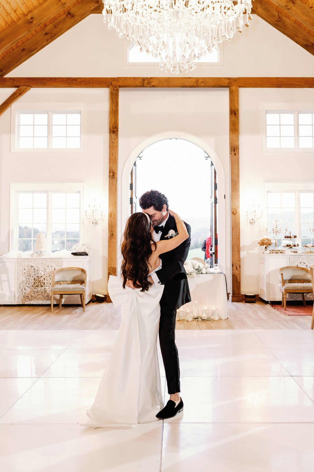 Bride wedding dress change with floor length oversized bow 