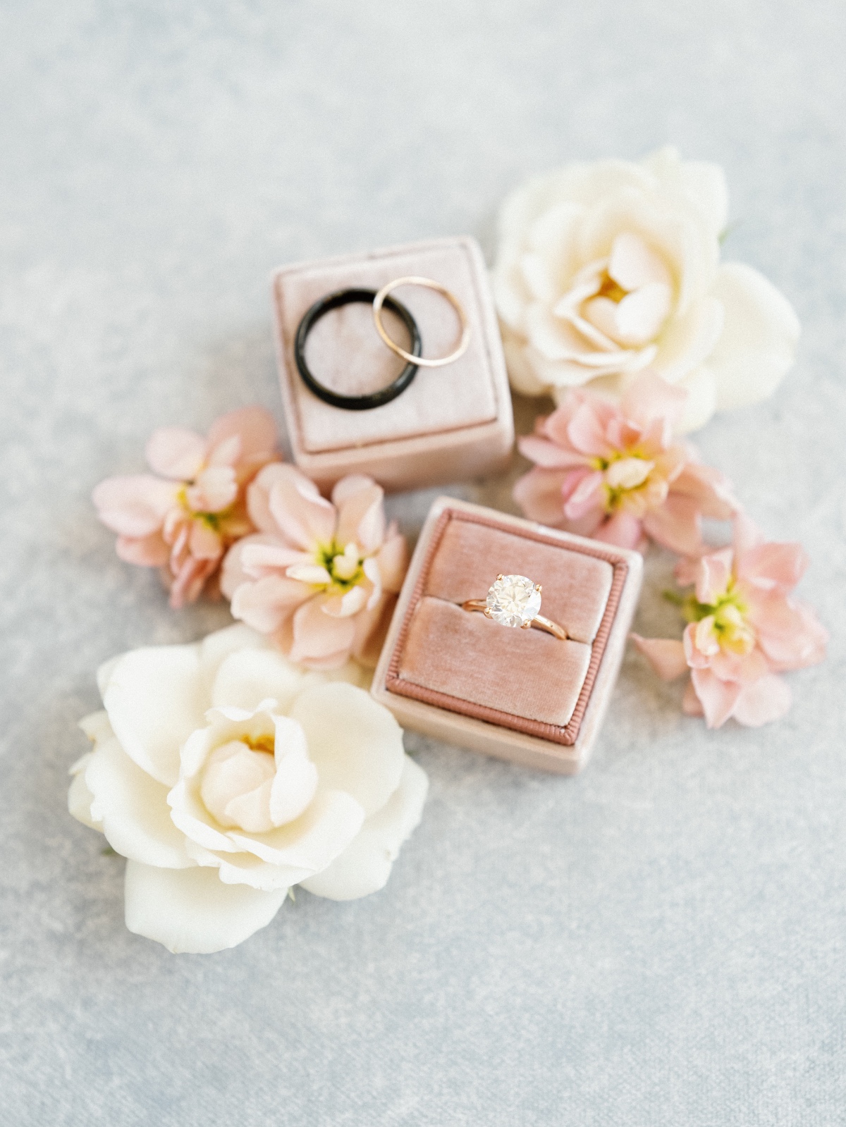 Blush pink velvet ring box with pastel pink wedding flowers