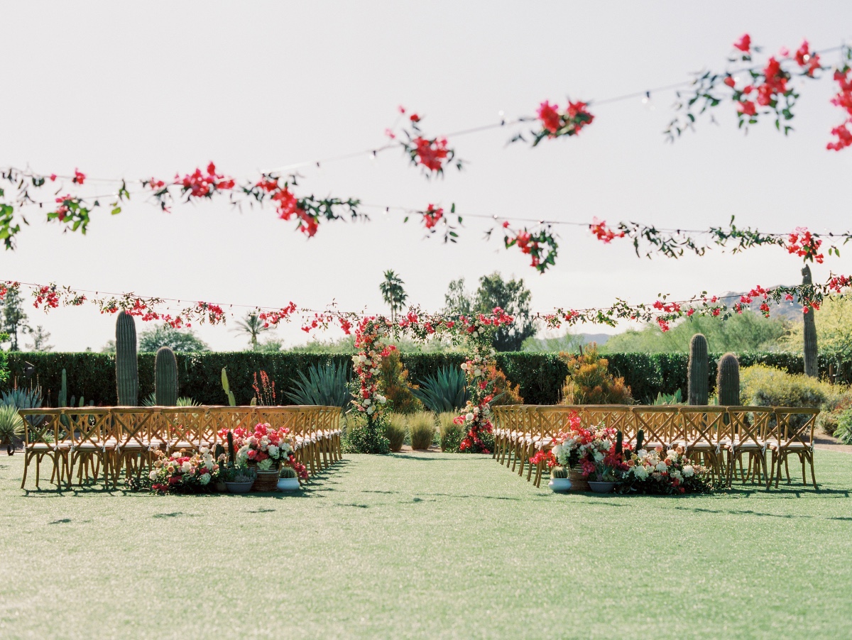 Pink bougainvillea silhouetted wedding ceremony