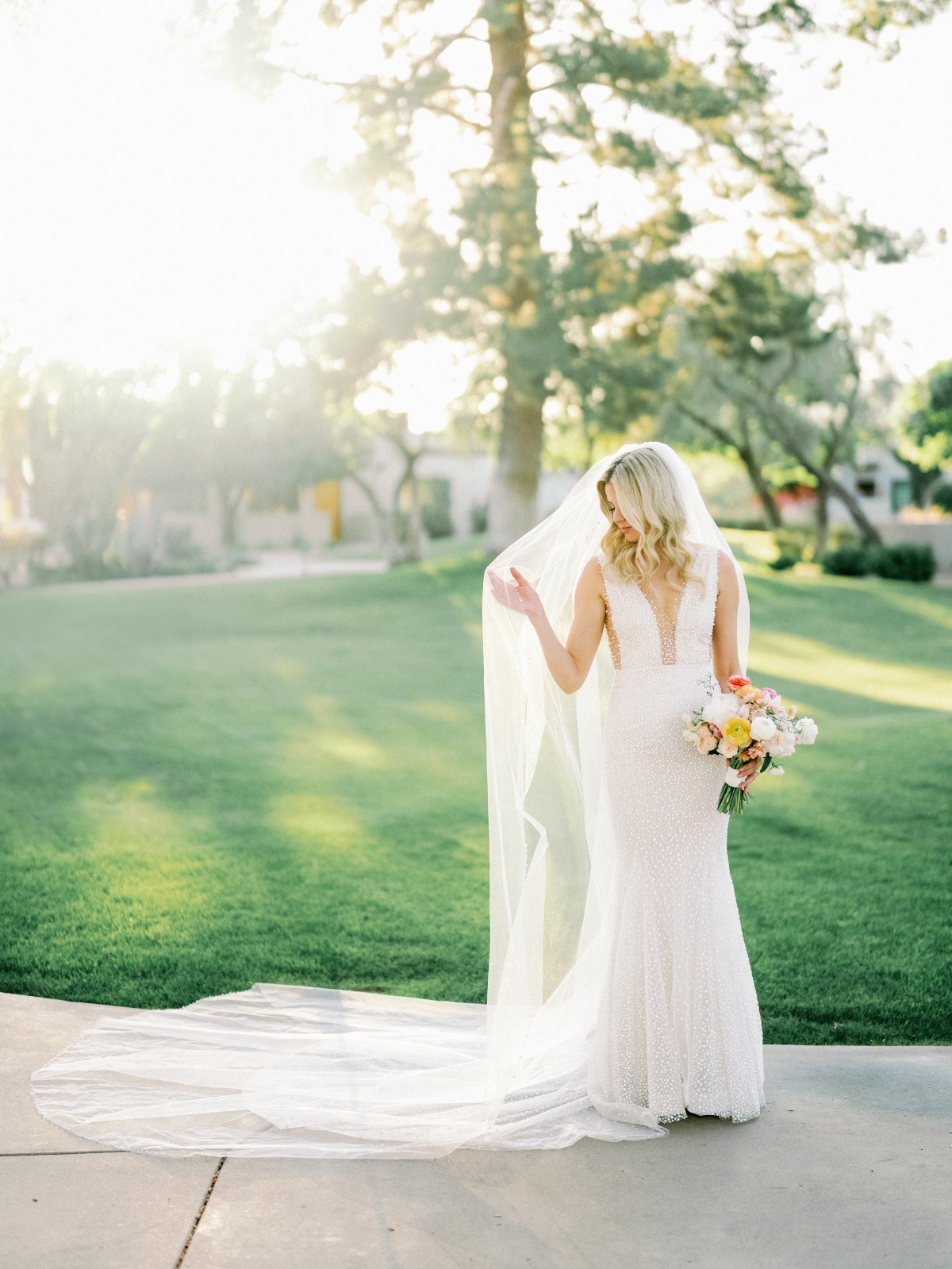 Elegant Arizona bride in pearl Pronovias wedding gown